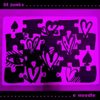 lil junks release cover. oversized puzzle with hearts, aces, and eye.